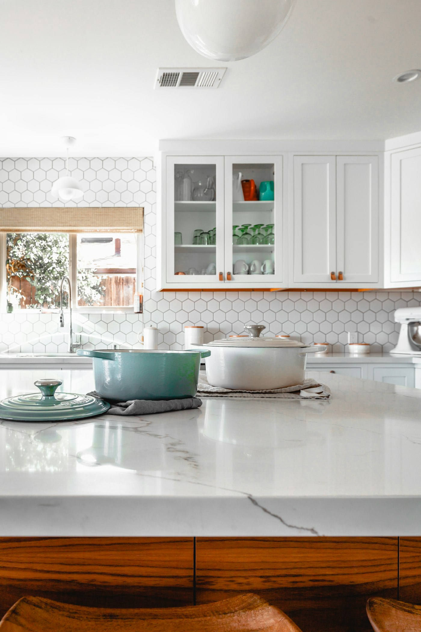 Custom kitchen with white cabinets and a stone island