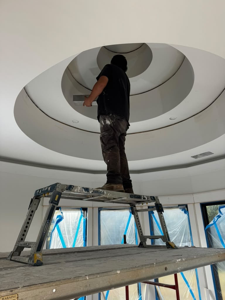 Finishing a curved drywall ceiling.