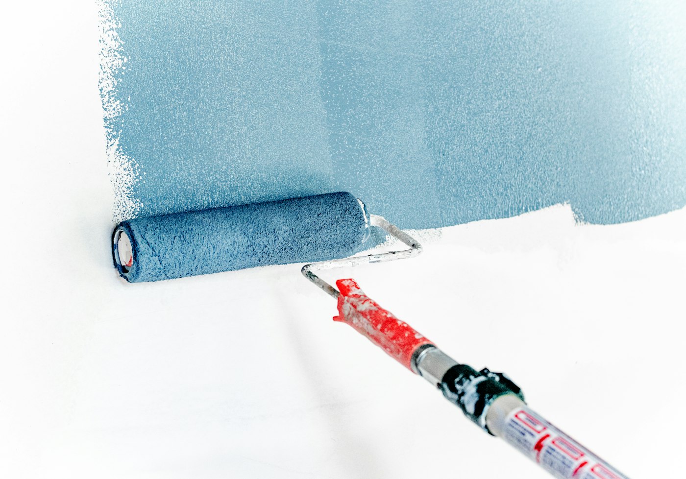 Paint roller covering a wall