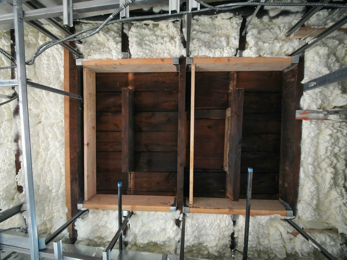 Spray foam insulation in a framed wall